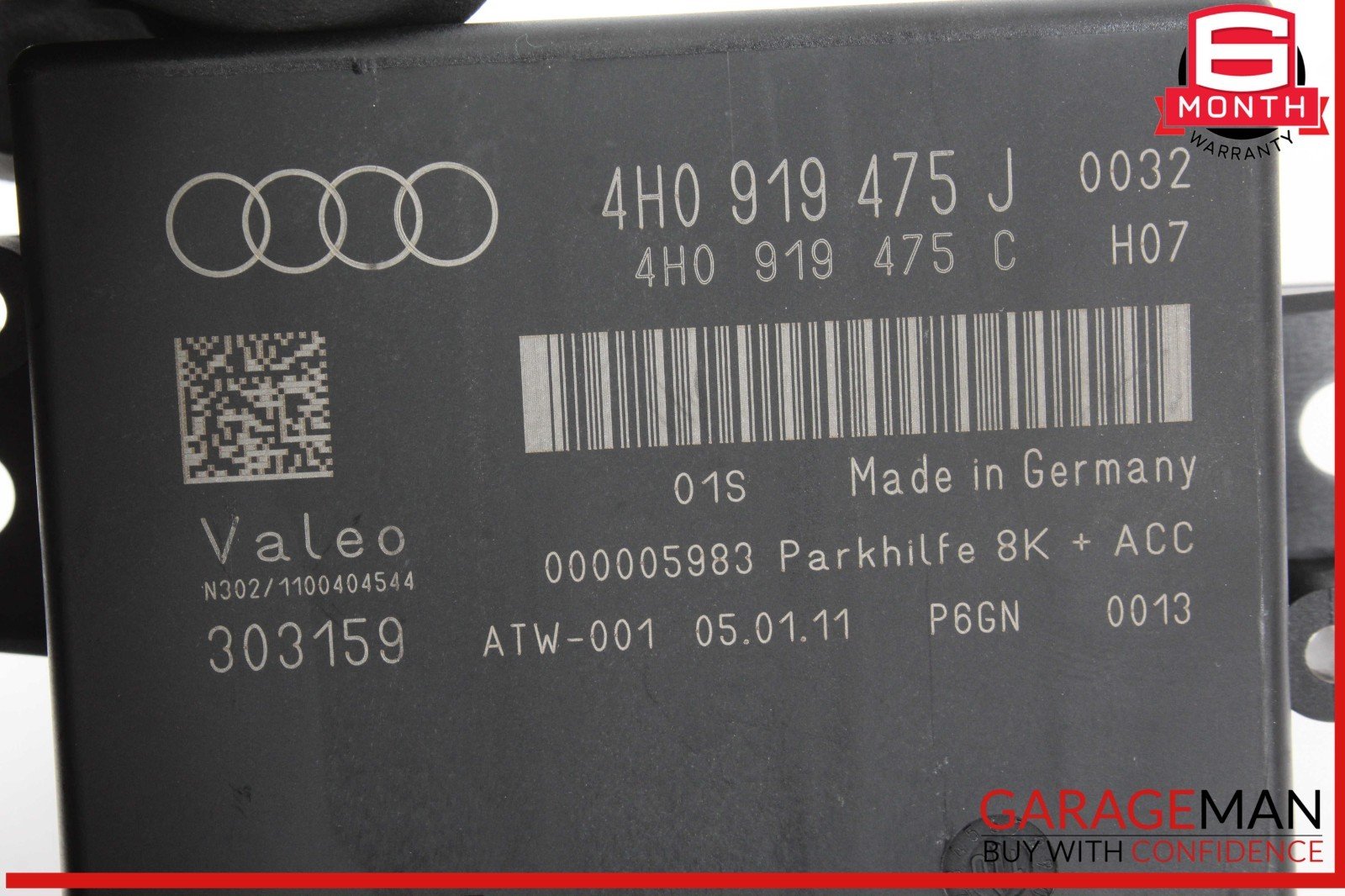 Audi part label with technical details and barcode on a black background
