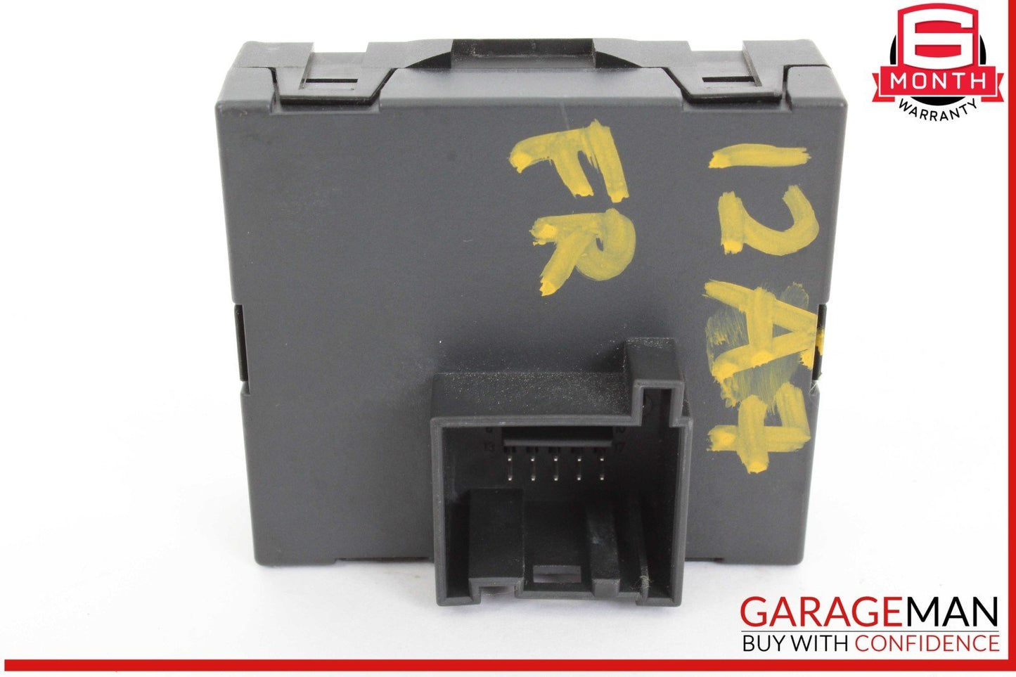 Black plastic component with yellow markings on a white background, featuring the GarageMan logo.