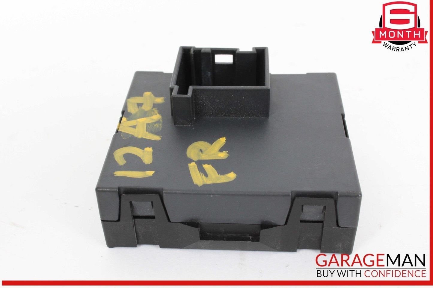 Black plastic component with yellow markings on a white background, featuring the GarageMan logo.
