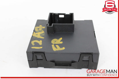 Black plastic component with yellow markings on a white background, featuring the GarageMan logo.