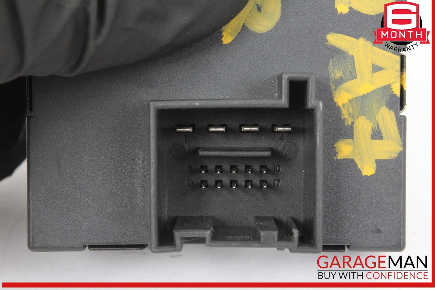 Close-up of a car diagnostic tool with 'Garageman' branding.